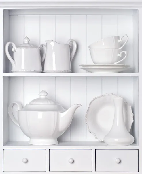 White shelf with vintage porcelain tableware — Stock Photo, Image