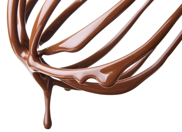 Whisk with melted chocolate over white — Stock Photo, Image