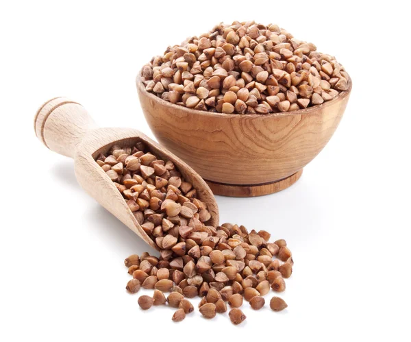 Buckwheat in a wooden bowl isolated on white — Stock Photo, Image