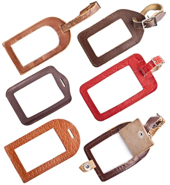 Collection of leather luggage tags isolated on white — Stock Photo, Image