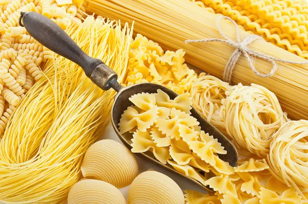 Retro still life with assortment of uncooked pasta — Stock Photo, Image