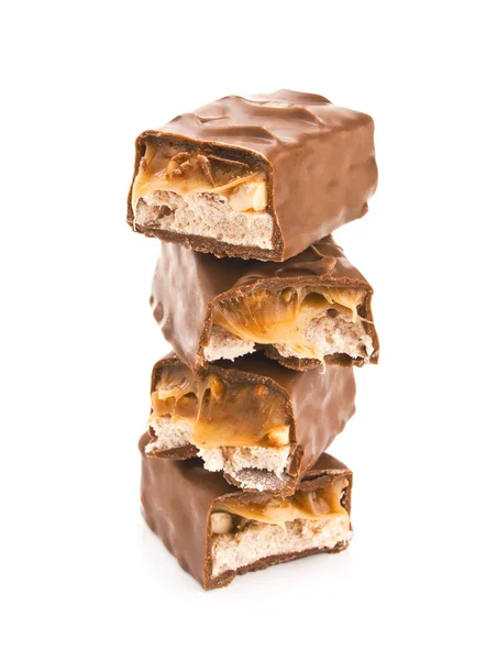 Mucchio di barrette di cioccolato isolato su bianco — Foto Stock