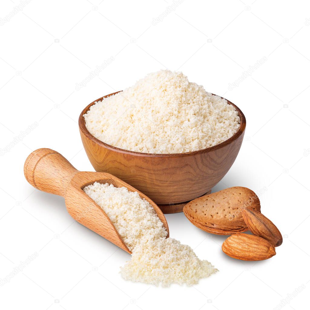 Wooden bowl and scoop full of almond flour isolated on white. Deep focus