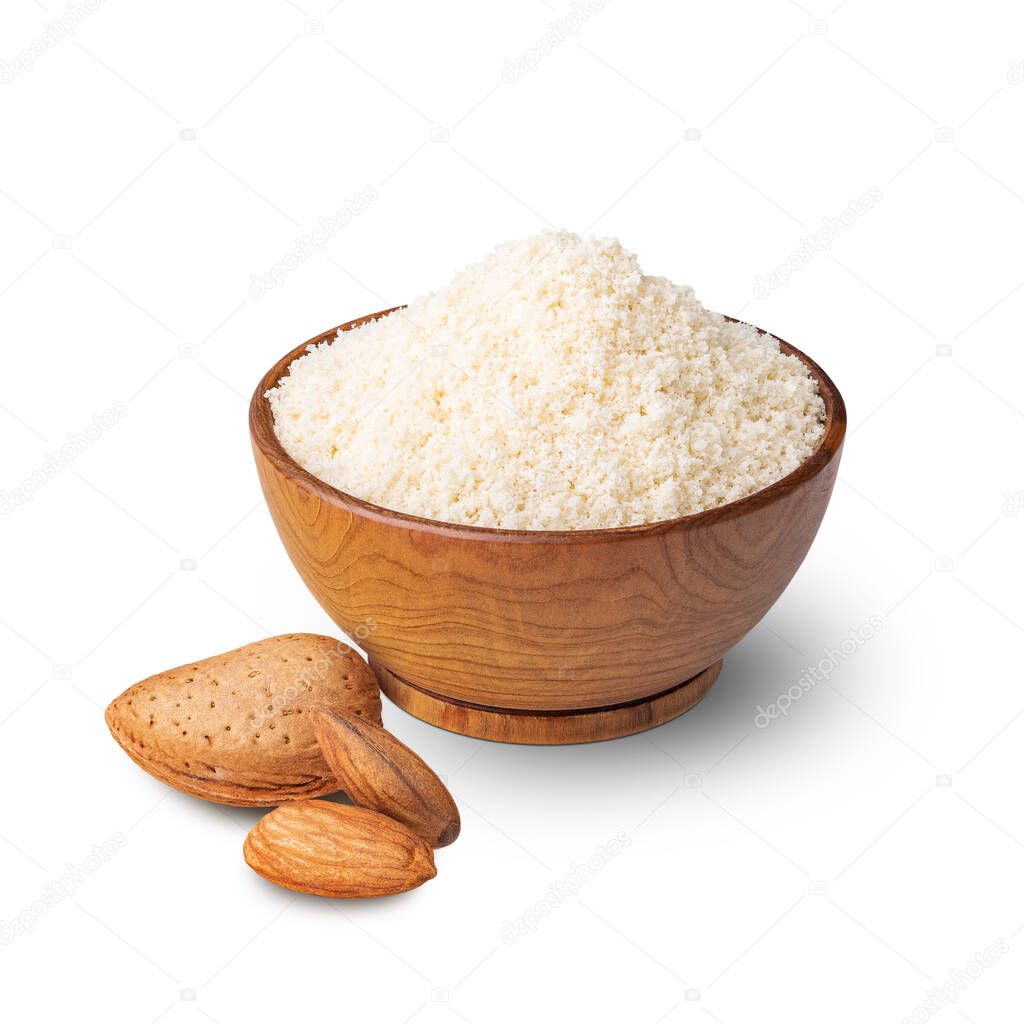 Wooden bowl full of almond flour isolated on white. Deep focus