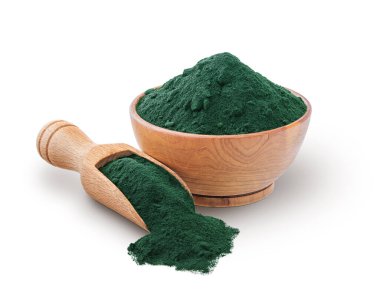Wooden scoop and bowl full of spirulina powder isolated on white background. Deep focus