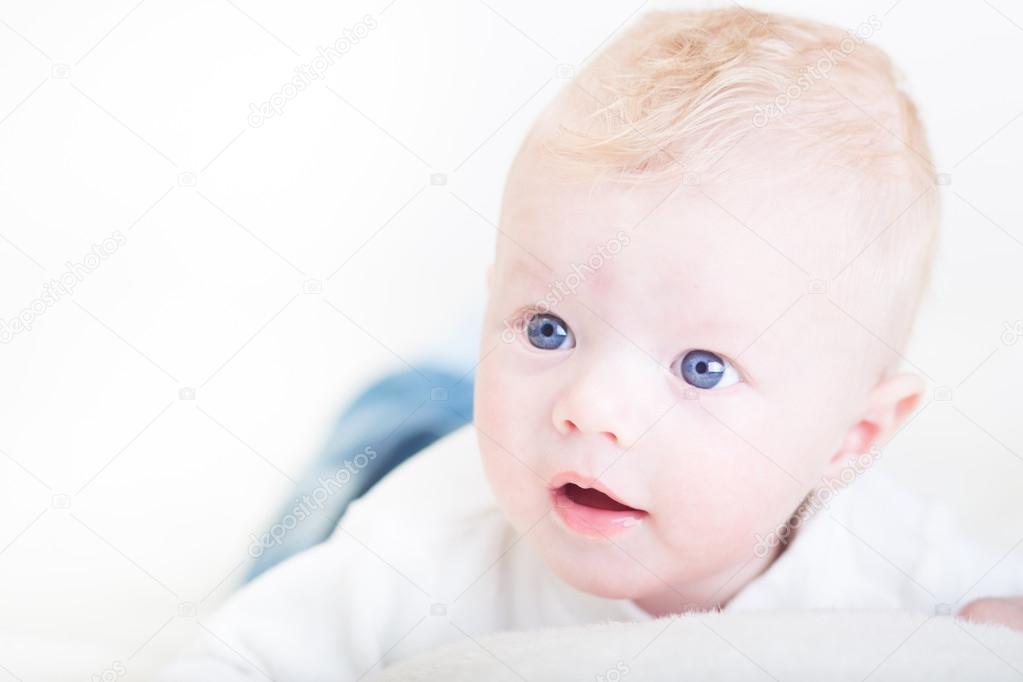 Baby with blue eyes Stock Photo by ©kasto 38391247