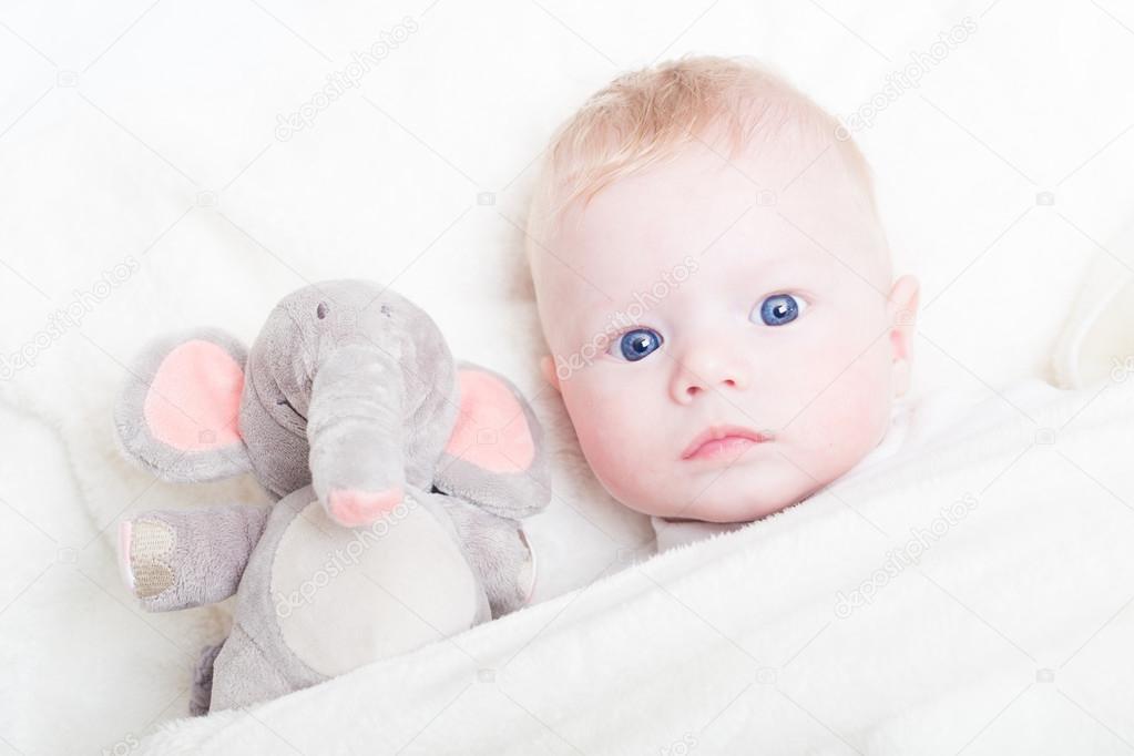 Baby with plush toy.