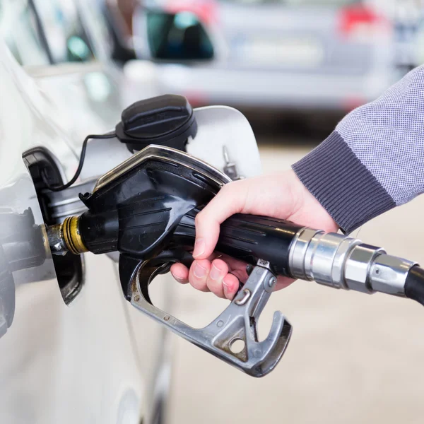 Petrol being pumped into a motor vehicle car. — Stock Photo, Image