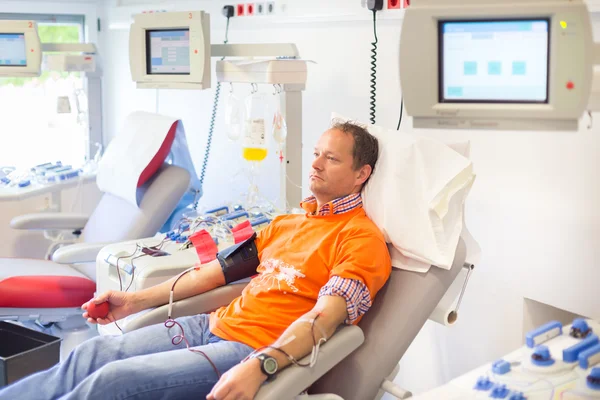 Blood donor at donation. — Stock Photo, Image