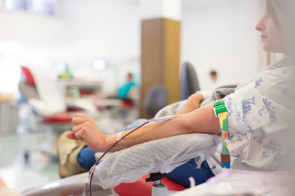 Nurse and blood donor at donation. — Stock Photo, Image