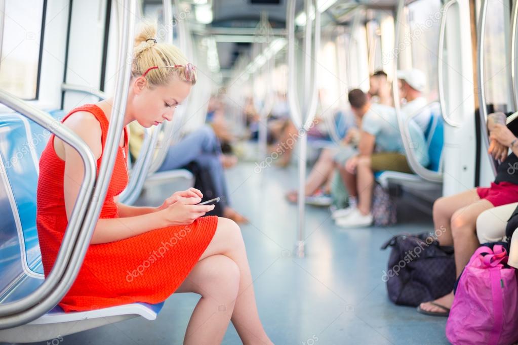 Lady traveling by metro.