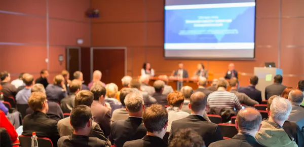 Pubblico nella sala conferenze. Immagine Stock