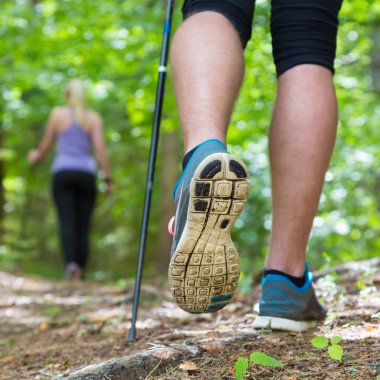 Young couple hiking in nature. Sport and exercise. clipart