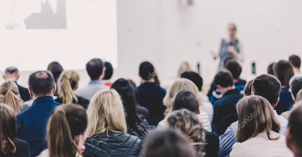 Woman giving presentation on business conference event