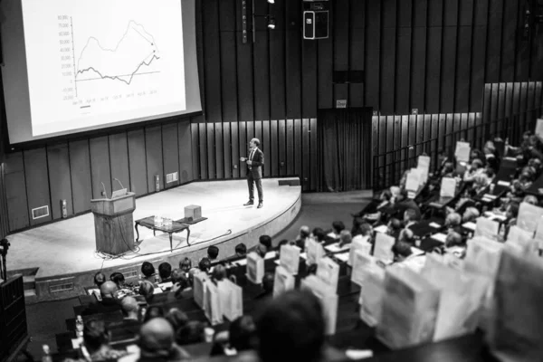 Speaker Giving a Talk at Business Meeting. Audience in the conference hall. Business and Entrepreneurship concept. Black and white.