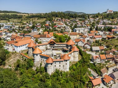 Aerial drone view of Medieval castle of Zuzemberk or Seisenburg or Sosenberch, positioned on terrace above the Krka River Canyon, Central Slovenia