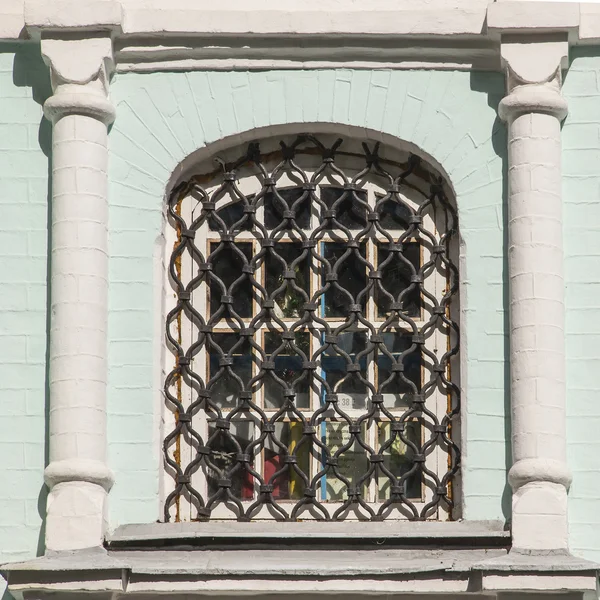 Window with an iron lattice. — Stock Photo, Image