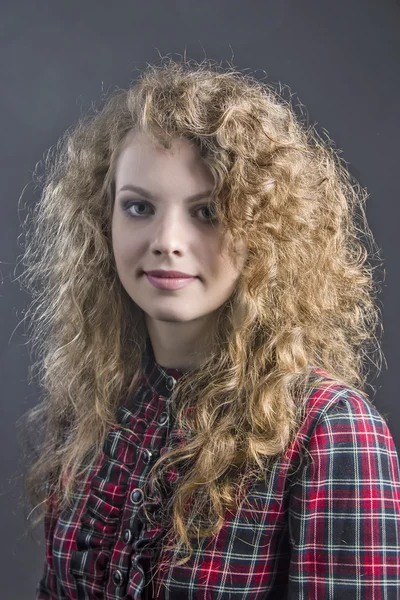 The young girl in a checkered dress — Stock Photo, Image