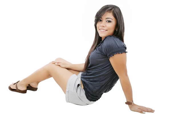 Attractive young girl sitting on the floor. All on white backgro — Stock Photo, Image