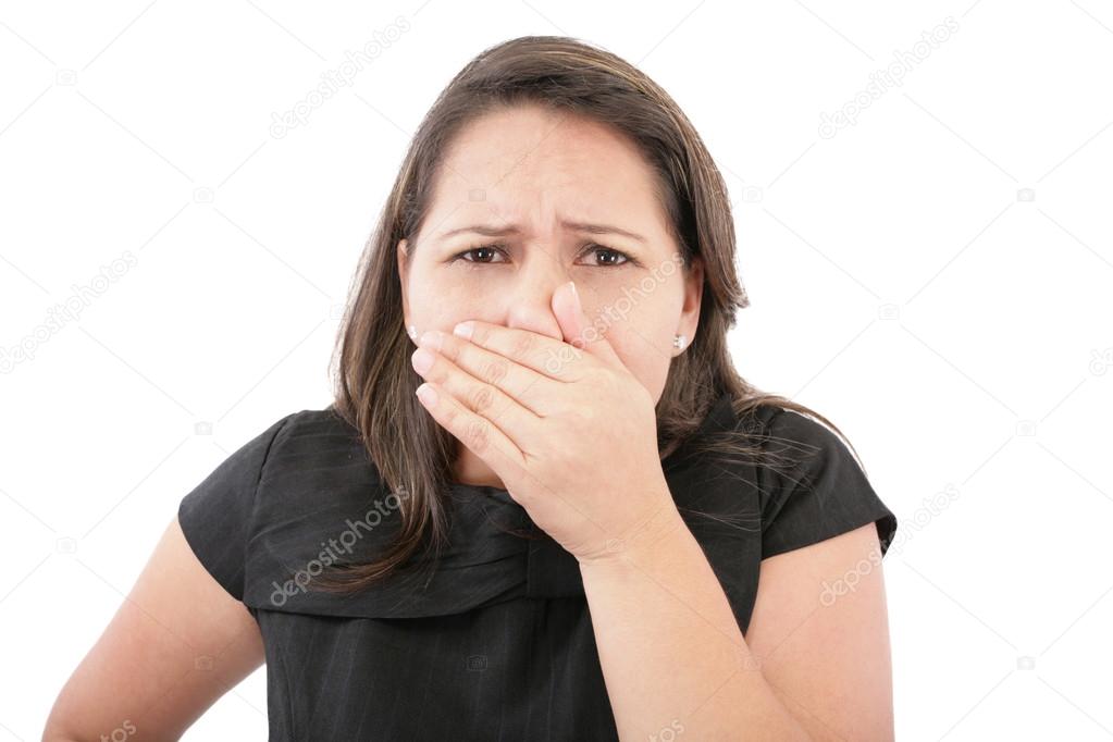 Covering her nose after a bad smell