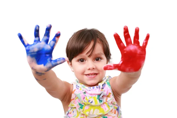 Menina bonita com as mãos na tinta — Fotografia de Stock