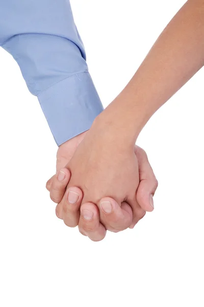Крупный план молодой любящей пары, держащейся за руки над белой ба — стоковое фото