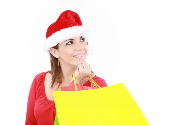Приваблива жінка в різдвяній шапці пакети рук, ізольовані на w — стокове фото