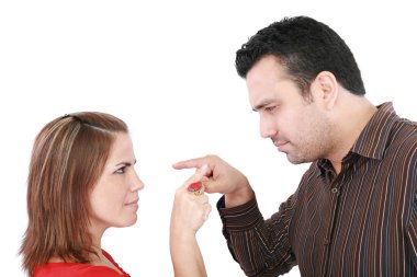 Young couple pointing at each other against a white background clipart