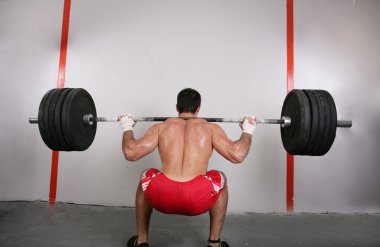 The concept of power and determination of a man lifting a weight clipart