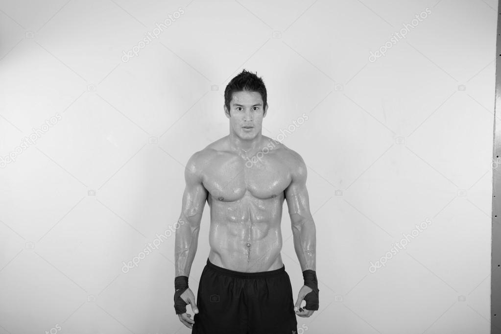 Image of muscle man posing in gym