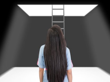 woman standing in a pit looking up to the ladder that leads out clipart