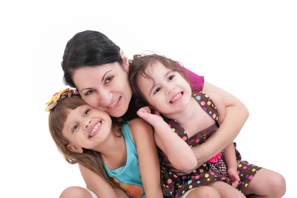 Happy mother and two daughters. Isolated on white background — Stock Photo, Image