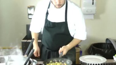 Male chef preparing tasty food in kitchen