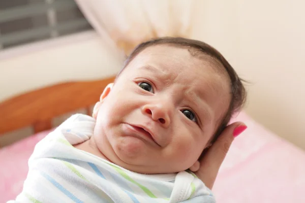 Woman holding a beautiful sweet hispanic newborn crying — Stock Photo, Image