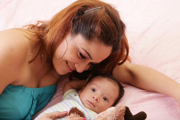 Hispanic mother with her adopted boy — Stock Photo, Image