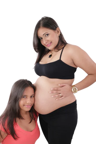 Beautiful pregnant woman with her daughter Royalty Free Stock Images