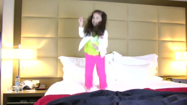 Little girl jumping in bed — Stock Video