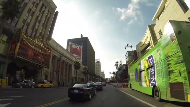 HOLLYWOOD, CA, CIRCA 2014: Driving along Hollywood Boulevard during the day circa 2014 in Hollywood. All tourist and visitors crowded on streets. — Stock Video