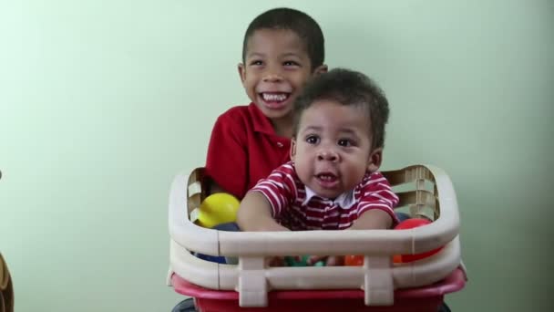 Brothers playing indoors — Stock Video