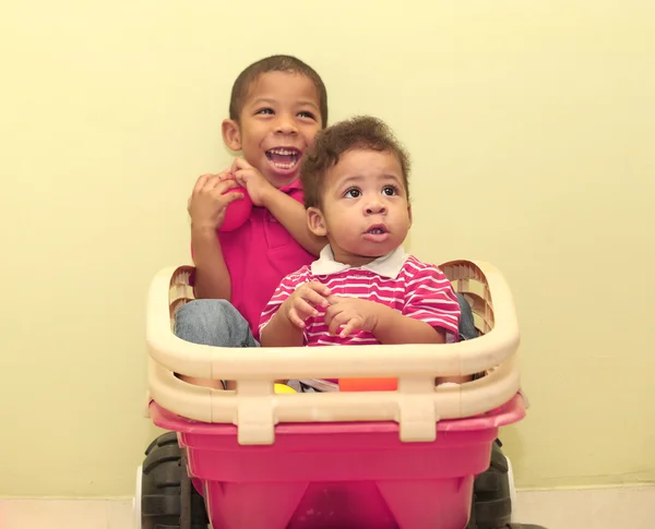 Portrait of two african boys inside a toy.  Focus in the front b — Stock Photo, Image