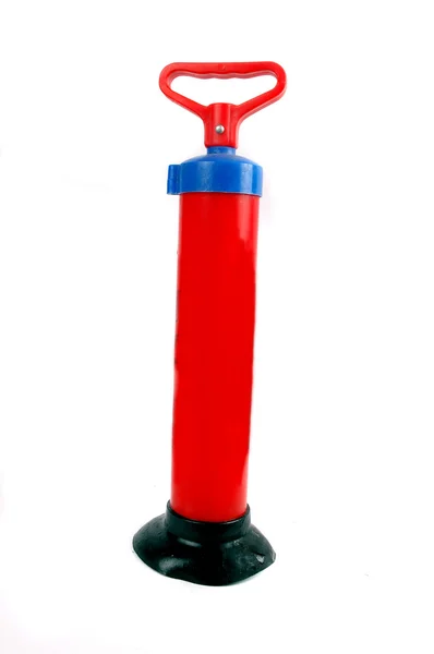 Red plastic pump — Stok fotoğraf