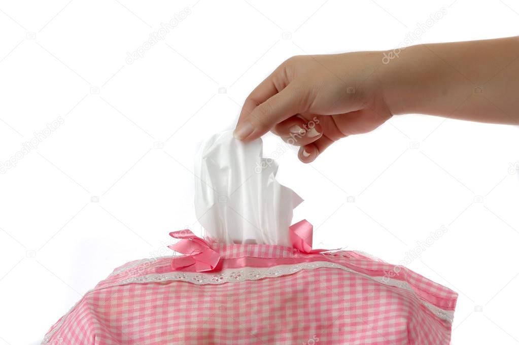 Woman's hand taking a piece of tissue paper