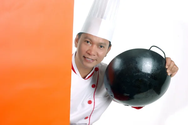 Šéfkuchař drží kuchyňské náčiní — Stock fotografie
