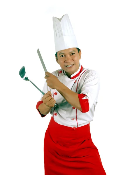 Chef segurando utensílios de cozinha e faca de cozinha — Fotografia de Stock