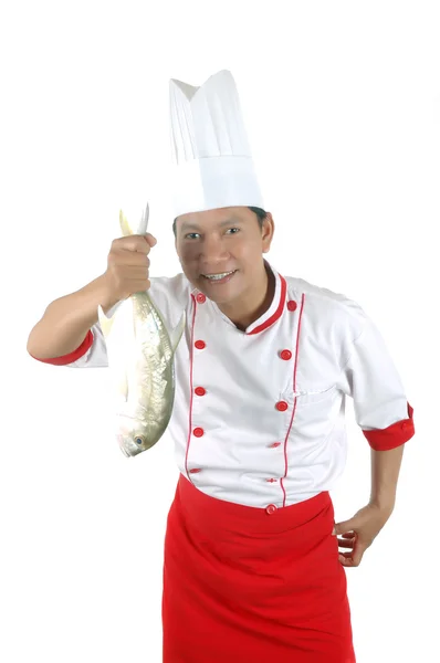 Chef tenant un gros poisson cru — Photo
