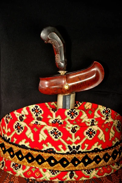 Keris is traditional weapons of Javanese Indonesia tucked behind the waist — Stock Photo, Image