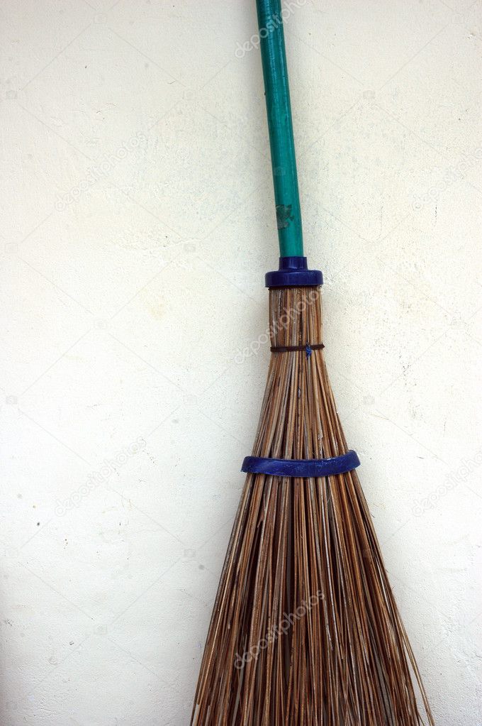A broom stick on the wall