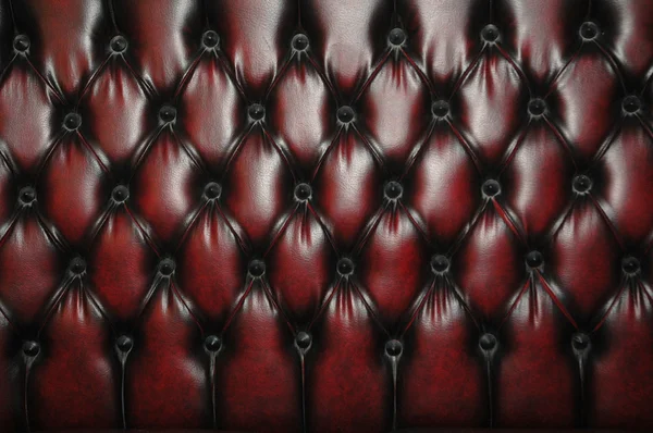 Textura e padrão de estofos de assento de couro escuro vermelho — Fotografia de Stock