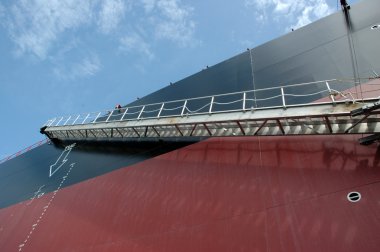 ladder at a big tanker ship, which was anchored in the middle of the ocean clipart