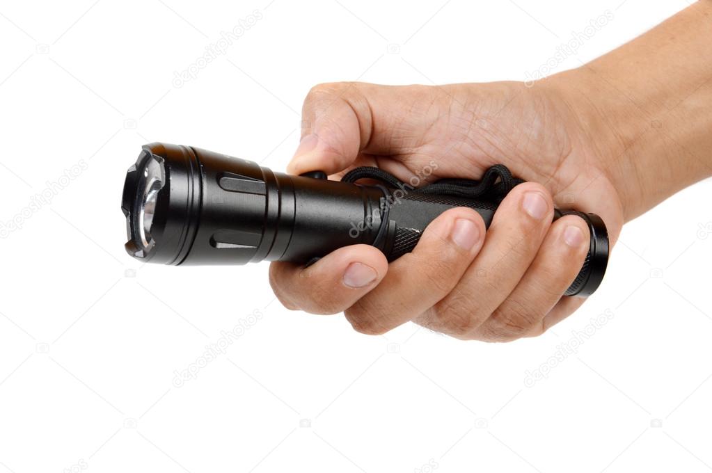 hand holding a black flashlight